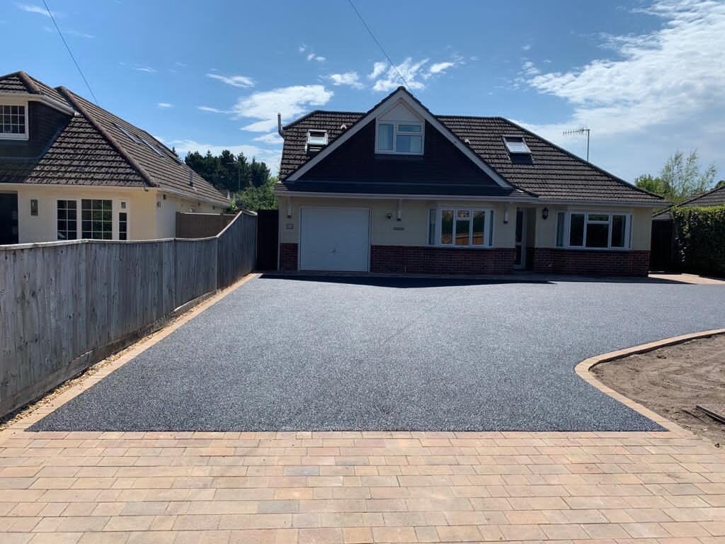 Close-up detail of a asphalt (tarmac) driveway by White & Sons