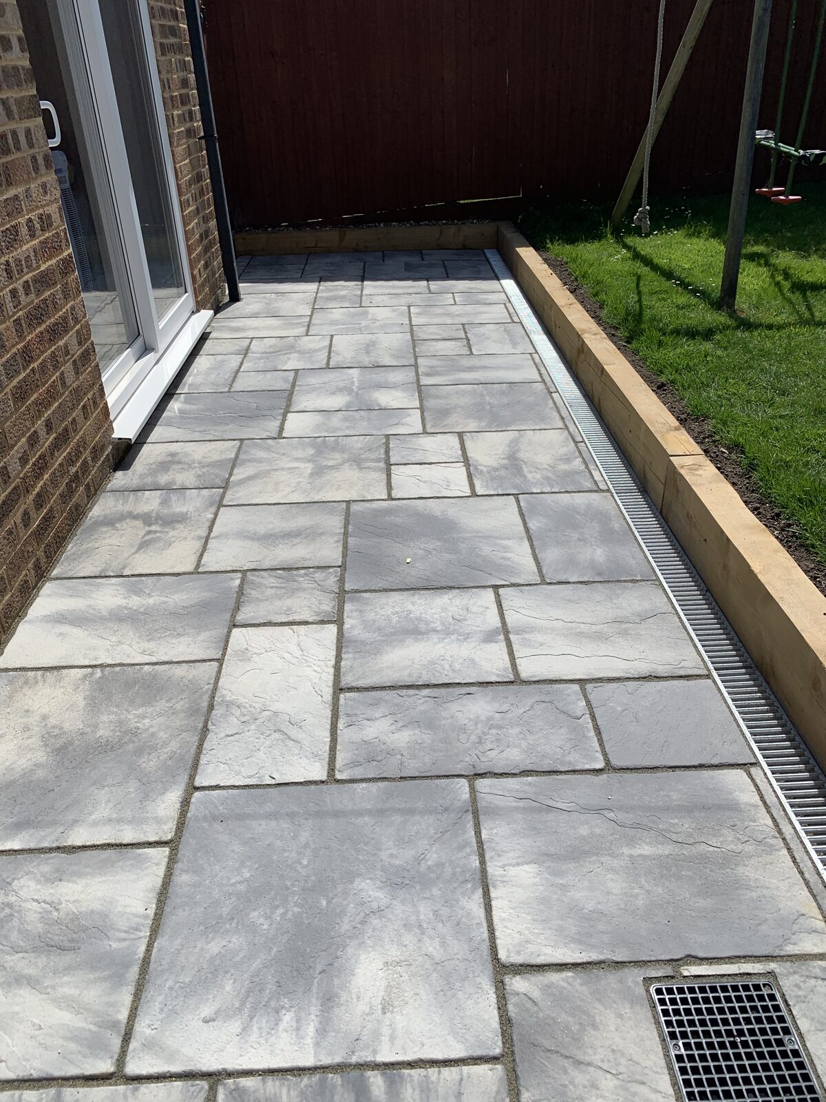Close-up detail of a natural stone patio by White & Sons